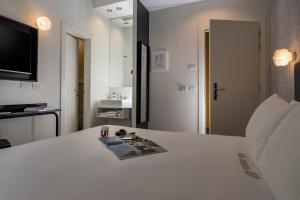 Een TV en/of entertainmentcenter bij Up Hotel
