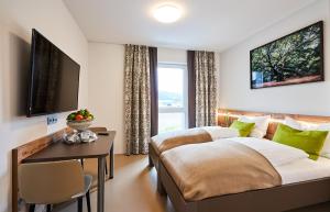 Ένα ή περισσότερα κρεβάτια σε δωμάτιο στο Huemer-Park Motel Vöcklatal