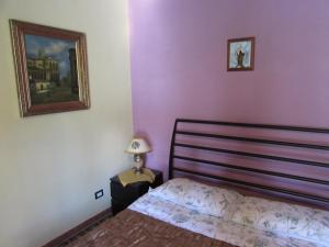 Posteľ alebo postele v izbe v ubytovaní Antico Palazzo