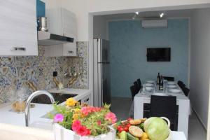 Kuchyň nebo kuchyňský kout v ubytování CASA VACANZA NELLE MALDIVE DEL SALENTO + 17 fotografií