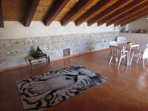 a living room with a tiger rug on the floor at Antico Palazzo in Giardini Naxos