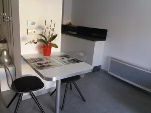 a small room with a white table and two chairs at Park Horizon in Sainte-Maxime