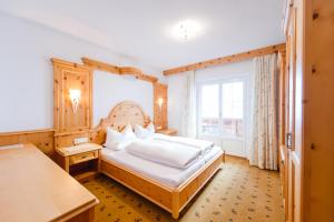 מיטה או מיטות בחדר ב-Sonnhof Appartements