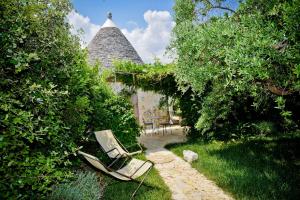 Vonkajšia záhrada v ubytovaní Leonardo Trulli Resort