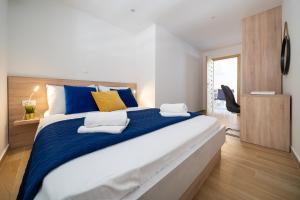 Ein Bett oder Betten in einem Zimmer der Unterkunft Holiday Home Apartments Bellamare