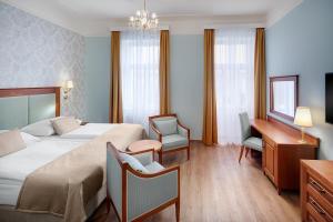 Ένα ή περισσότερα κρεβάτια σε δωμάτιο στο Ensana Hvězda - Imperiál - Neapol