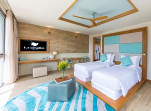 Postel nebo postele na pokoji v ubytování Fusion Suites Vung Tau
