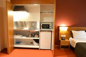 
Una cocina o zona de cocina en Paredes Hotel Apartamento
