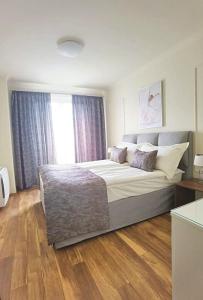Postel nebo postele na pokoji v ubytování Aqua Viva Spa Hotel