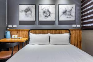 Ένα ή περισσότερα κρεβάτια σε δωμάτιο στο Hualien So Funny BnB