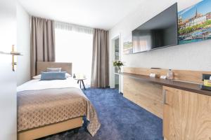 TV a/nebo společenská místnost v ubytování Hotel Tivoli