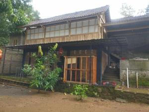 a house with an open door in front of it at Homestay Kurnia in Bantul +19 photos