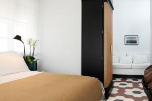 A bed or beds in a room at Magnolia Boutique Rooms