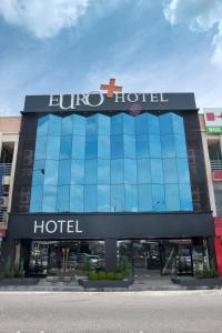 a building with a bulovo hotel sign on it at Euro+ Hotel Johor Bahru in Johor Bahru