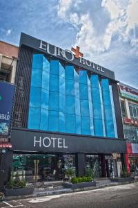 a building with a buloco hotel on a street at Euro+ Hotel Johor Bahru in Johor Bahru