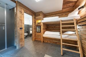 Postel nebo postele na pokoji v ubytování Hotel Majon Miramonti