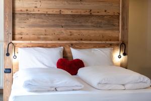 Postel nebo postele na pokoji v ubytování Hotel Majon Miramonti