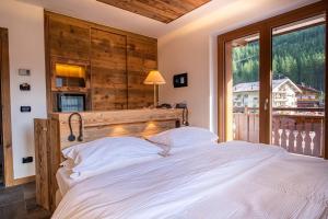 Postel nebo postele na pokoji v ubytování Hotel Majon Miramonti