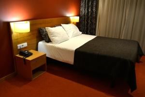 
Cama o camas de una habitación en Paredes Hotel Apartamento
