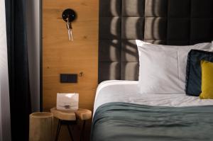 Postel nebo postele na pokoji v ubytování Hotel Rum Budapest