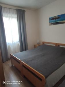 Postel nebo postele na pokoji v ubytování Apartments Davor