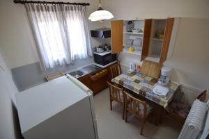 Kuchyň nebo kuchyňský kout v ubytování Jimmy's Apartments