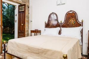 Postel nebo postele na pokoji v ubytování Borgo Lu Puleu