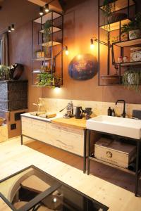 a kitchen with a sink and a counter at ANNAS STUBE - Boutique Design Bauernhof in Waldkirch