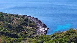 a view of the ocean from a hill at Apartments Tanja in Zavalatica