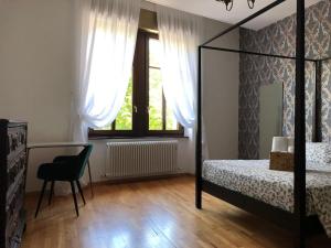 Ένα ή περισσότερα κρεβάτια σε δωμάτιο στο B&B Trento - Only self check-in
