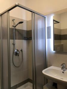 a bathroom with a shower and a sink at B&B Trento - Only self check-in in Trento