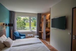 Postel nebo postele na pokoji v ubytování TUI BLUE Montafon