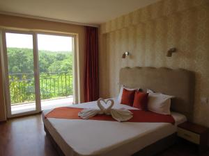 Postel nebo postele na pokoji v ubytování Family Hotel Dayana Beach