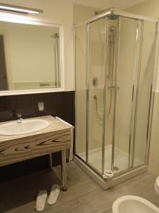 a bathroom with a shower and a sink at Hotel Miramare in Marina di Ragusa