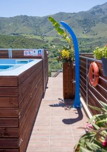 a deck with a plunge pool and a view of the mountains at Villa Iasonas in Kournás