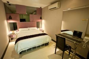 Posteľ alebo postele v izbe v ubytovaní Euro+ Hotel Johor Bahru