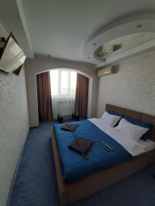 Postel nebo postele na pokoji v ubytování Отель