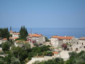 a view of a town with houses and trees at Reževići Apartments in Petrovac na Moru