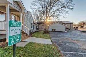 a sign in front of a house with aerved parking lot at Upcountry Inn in Helen