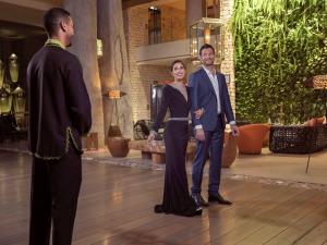 two men and a woman standing on a dance floor at Hotel Le Golf D'Essaouira & Spa in Essaouira +135 photos