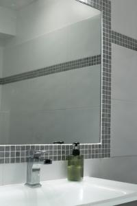 a bathroom sink with a large mirror above it at Mare e Vista in Ajaccio