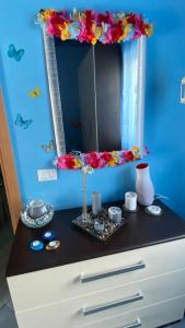 a dresser with a mirror on a blue wall at B&B Dolce Sogno in SantʼElpidio a Mare +131 photos