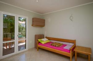 Postel nebo postele na pokoji v ubytování Apartments Ivo
