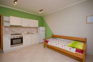 Kuchyň nebo kuchyňský kout v ubytování Apartments Ivo