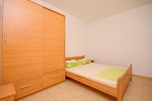 Postel nebo postele na pokoji v ubytování Apartments Ivo