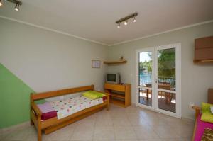 Postel nebo postele na pokoji v ubytování Apartments Ivo + 37 fotografií