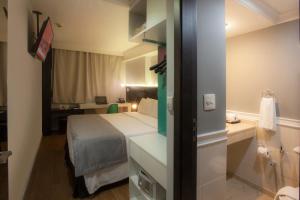 Cama ou camas em um quarto em Hotel WZ Jardins