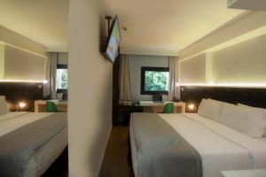 Cama ou camas em um quarto em Hotel WZ Jardins
