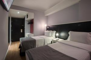 Cama ou camas em um quarto em Hotel WZ Jardins
