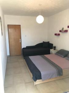Posteľ alebo postele v izbe v ubytovaní Apartmani Roxy
